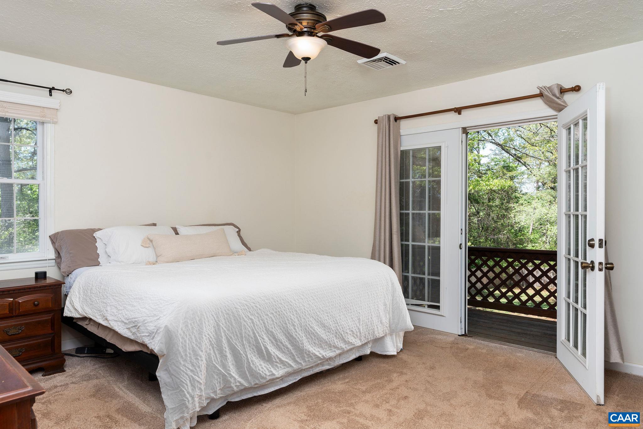 77 Sunset Drive Arrington, VA 22922 - Photo 20 of 35 a bedroom with a bed table and window