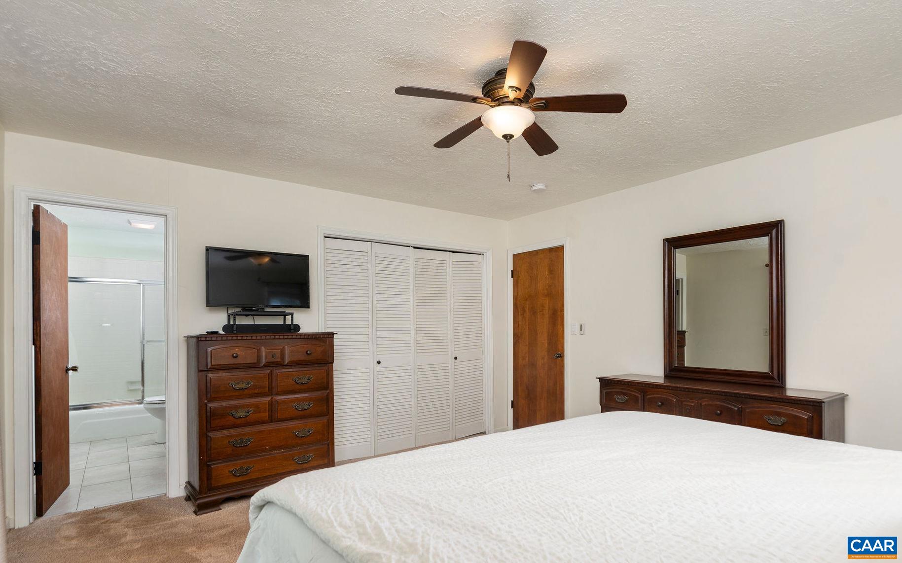 77 Sunset Drive Arrington, VA 22922 - Photo 21 of 35 a bedroom with a bed and a flat screen tv