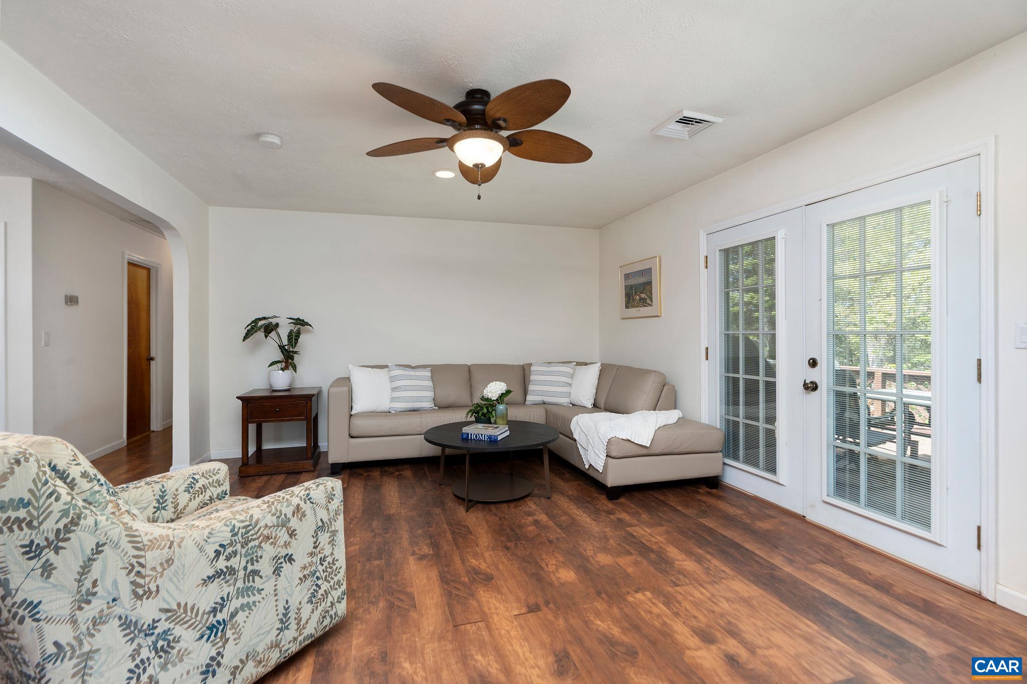 77 Sunset Drive Arrington, VA 22922 - Photo 4 of 35 a living room with furniture chandelier and a fireplace