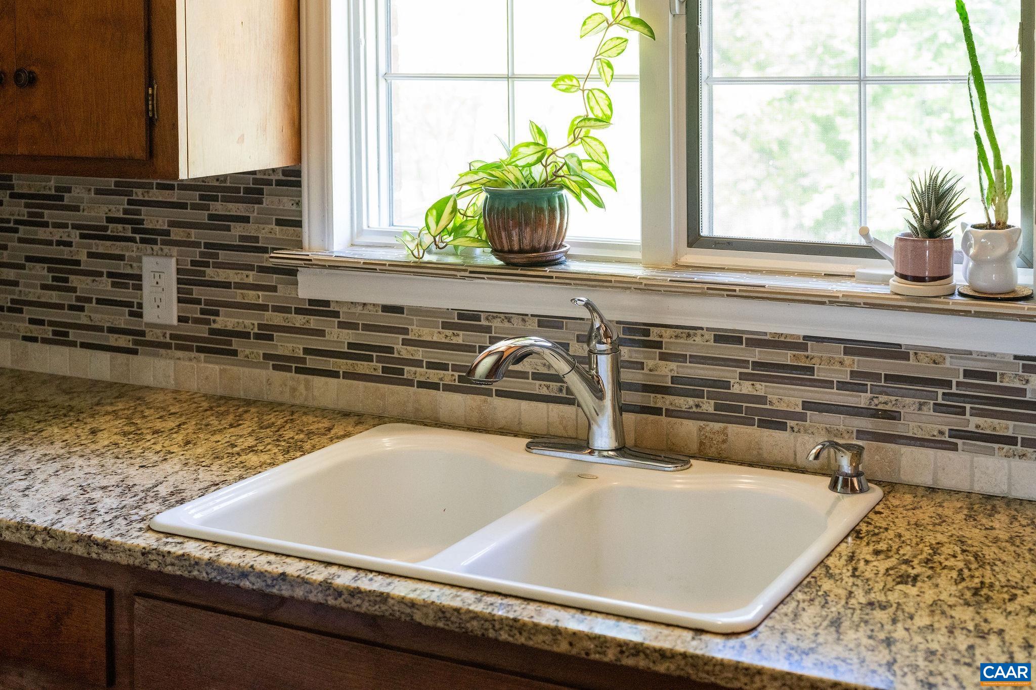 77 Sunset Drive Arrington, VA 22922 - Photo 10 of 35 a kitchen with a sink a counter top and a window