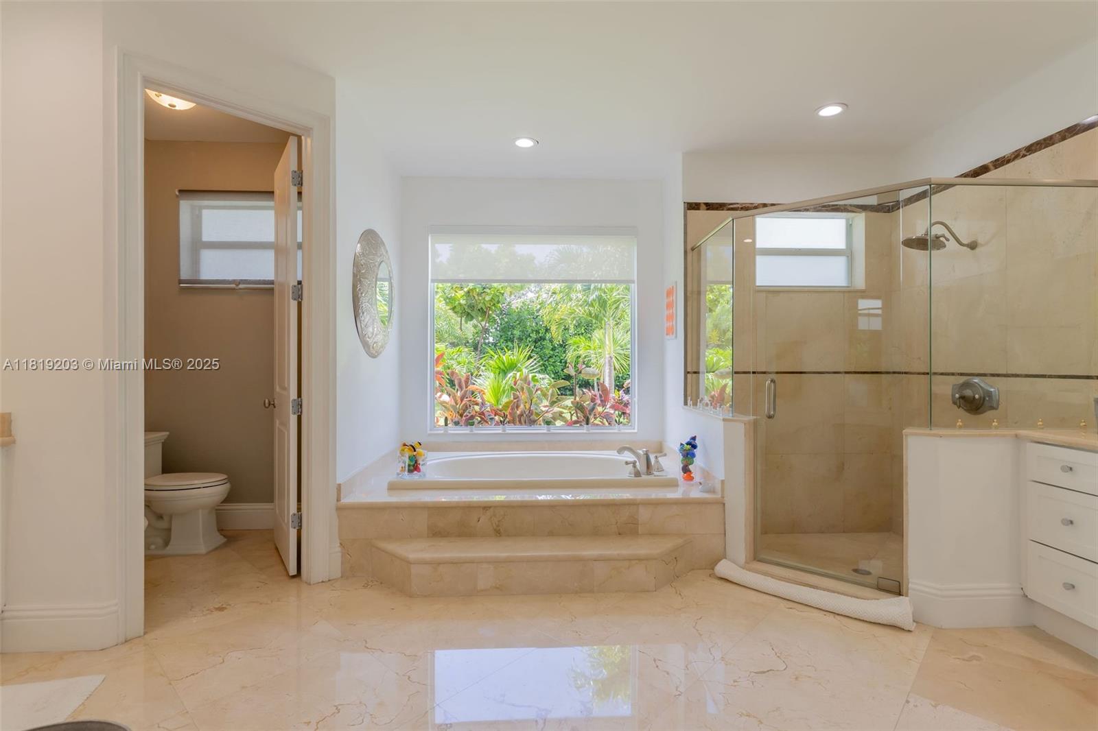 9532 Southwest 124th Terrace Miami, FL 33176 - Photo 11 of 30 a bathroom with a bathtub and a shower