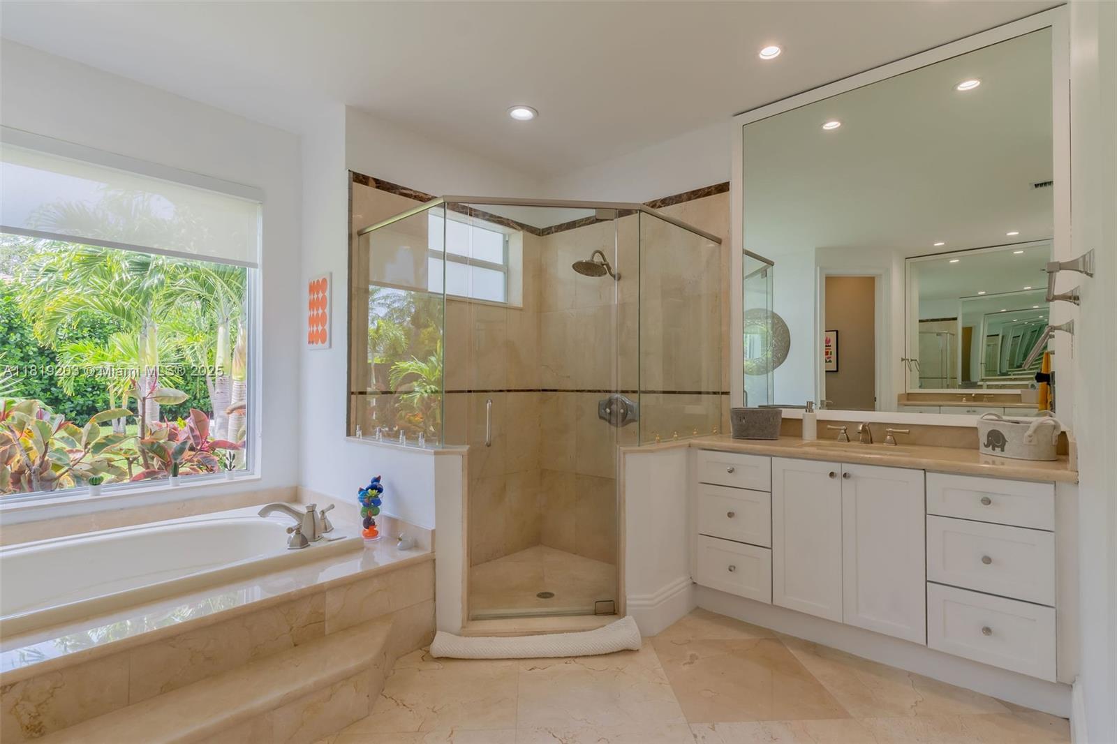 9532 Southwest 124th Terrace Miami, FL 33176 - Photo 12 of 30 a bathroom with a double vanity sink and a large mirror