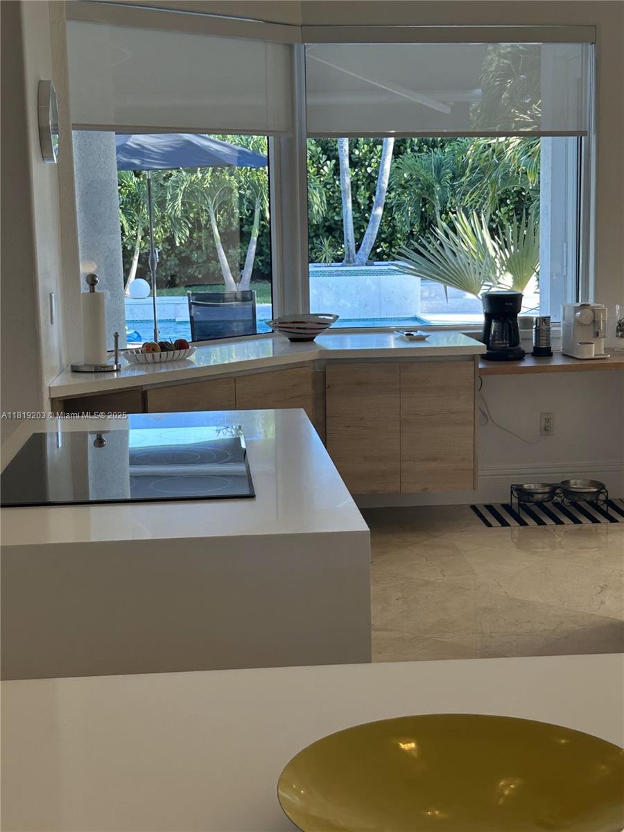 9532 Southwest 124th Terrace Miami, FL 33176 - Photo 25 of 30 a kitchen with kitchen island a large window
