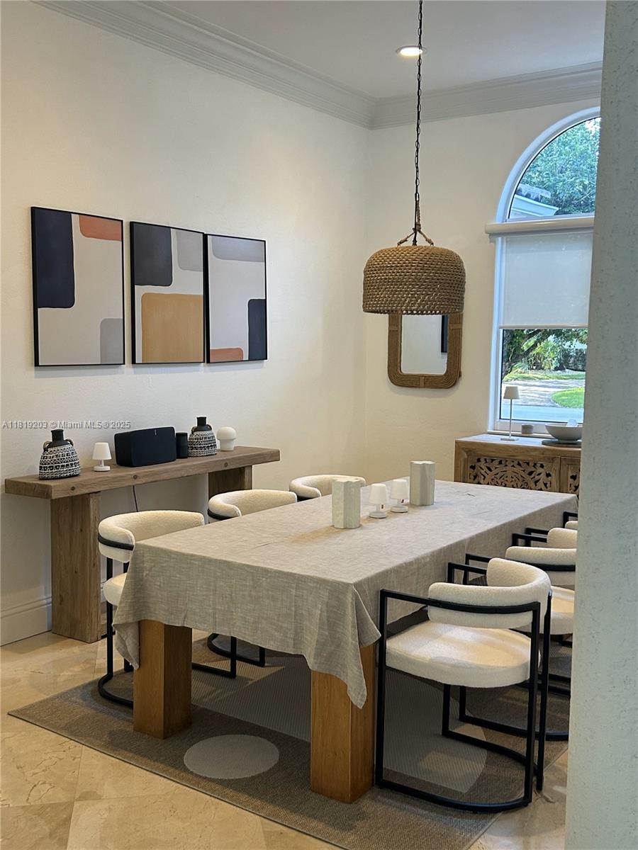 9532 Southwest 124th Terrace Miami, FL 33176 - Photo 29 of 30 a kitchen with a table chairs a sink dishwasher and a stove