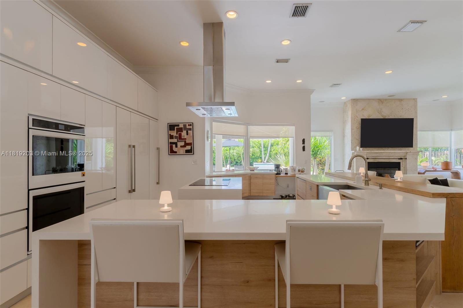 9532 Southwest 124th Terrace Miami, FL 33176 - Photo 6 of 30 a dining hall with stainless steel appliances kitchen island granite countertop a stove a sink a dining table and chairs with wooden floor