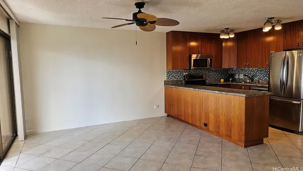 a kitchen with stainless steel appliances a refrigerator and a stove