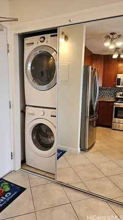 a view of a storage & utility room with washer and dryer