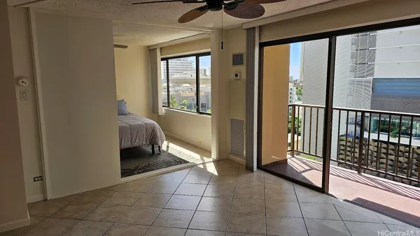a view of bedroom with furniture and windows