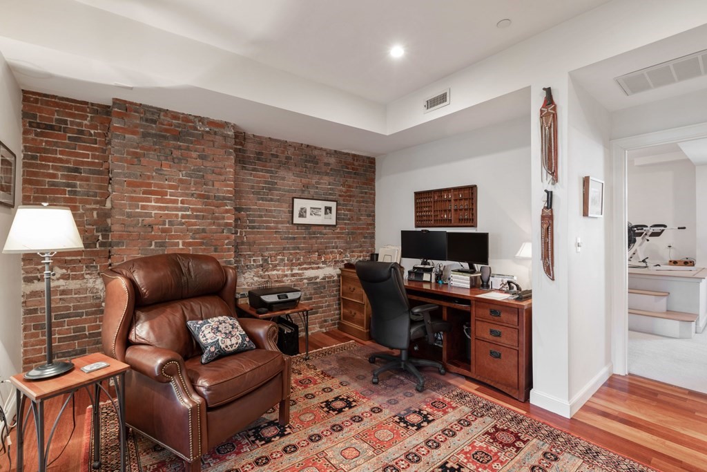 220 Commercial Street, Unit 5A Boston, MA 02109 - Photo 14 of 40 a living room with furniture and a flat screen tv