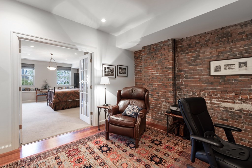 220 Commercial Street, Unit 5A Boston, MA 02109 - Photo 15 of 40 a living room with furniture and a rug