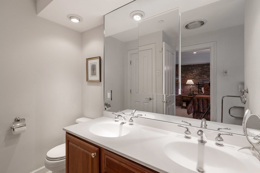 220 Commercial Street, Unit 5A Boston, MA 02109 - Photo 19 of 40 a bathroom with a sink and a mirror
