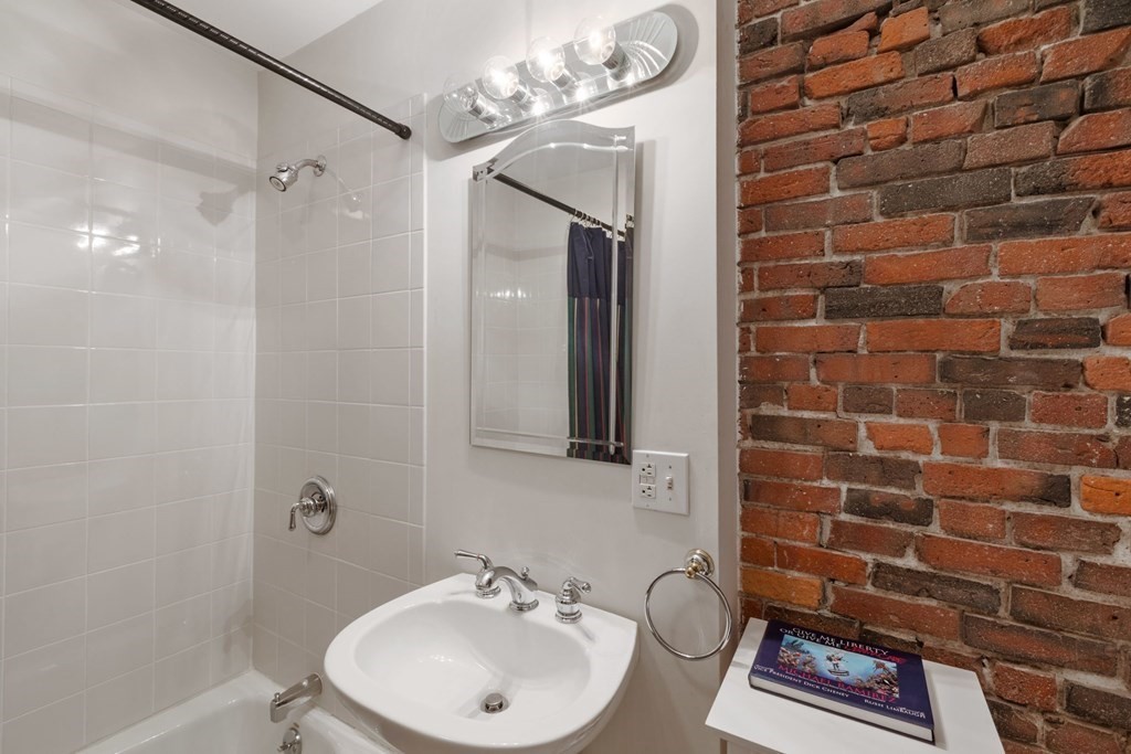 220 Commercial Street, Unit 5A Boston, MA 02109 - Photo 26 of 40 a bathroom with a sink a toilet and shower
