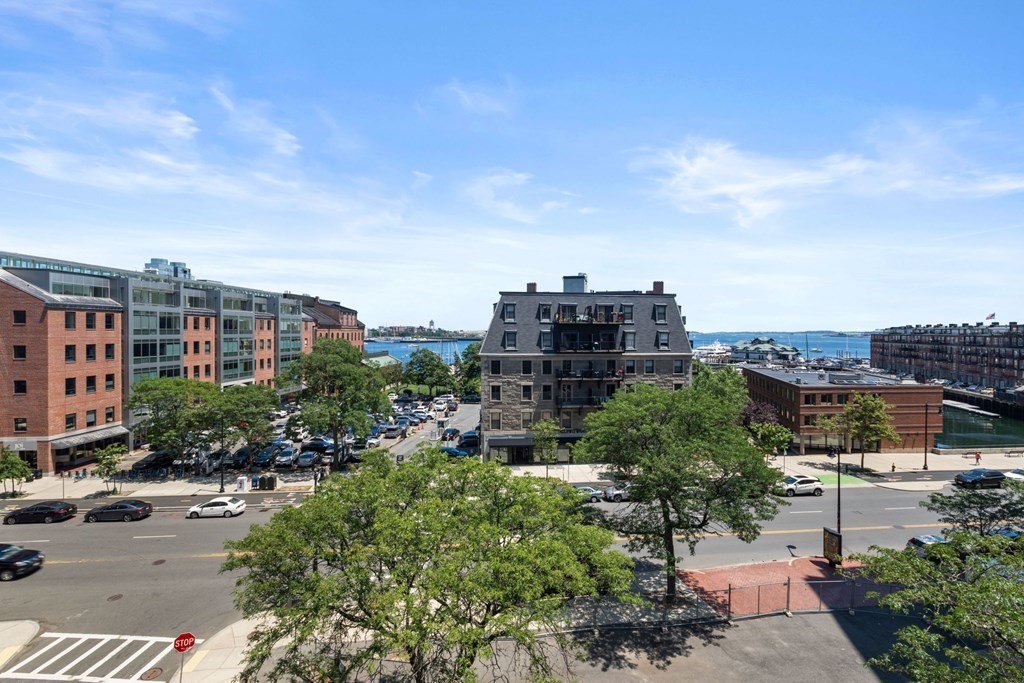 220 Commercial Street, Unit 5A Boston, MA 02109 - Photo 31 of 40 a view of a city with tall buildings