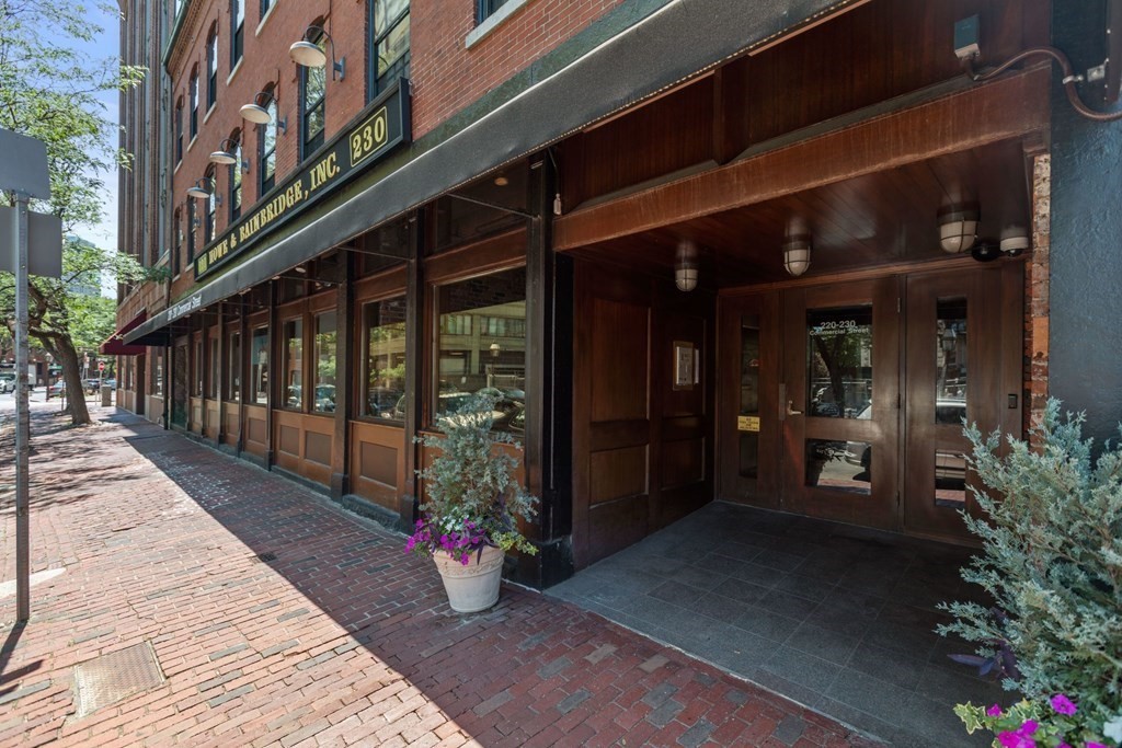 220 Commercial Street, Unit 5A Boston, MA 02109 - Photo 36 of 40 a view of a building with a potted plant in front of it