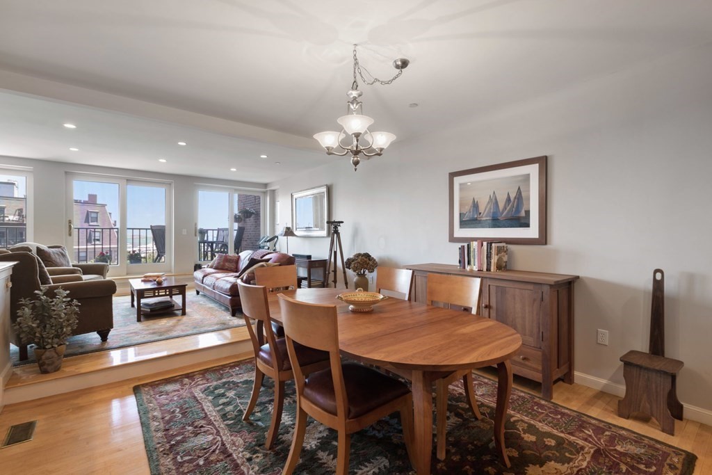 220 Commercial Street, Unit 5A Boston, MA 02109 - Photo 6 of 40 a view of a dining room with furniture