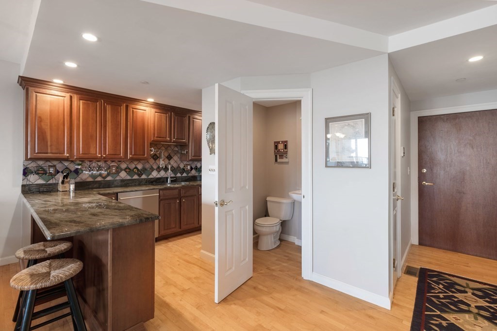 220 Commercial Street, Unit 5A Boston, MA 02109 - Photo 9 of 40 a bathroom with a sink a toilet and shower
