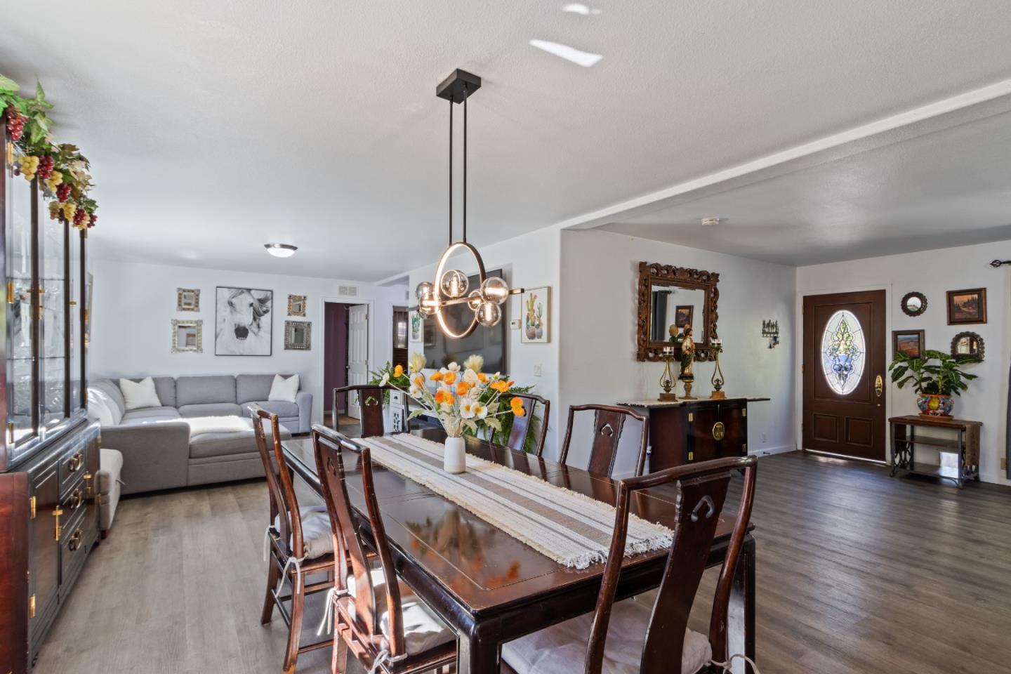 37200 Nason Road, Unit 18 Carmel Valley, CA 93924 - Photo 13 of 71 a view of a dining room with furniture window and wooden floor