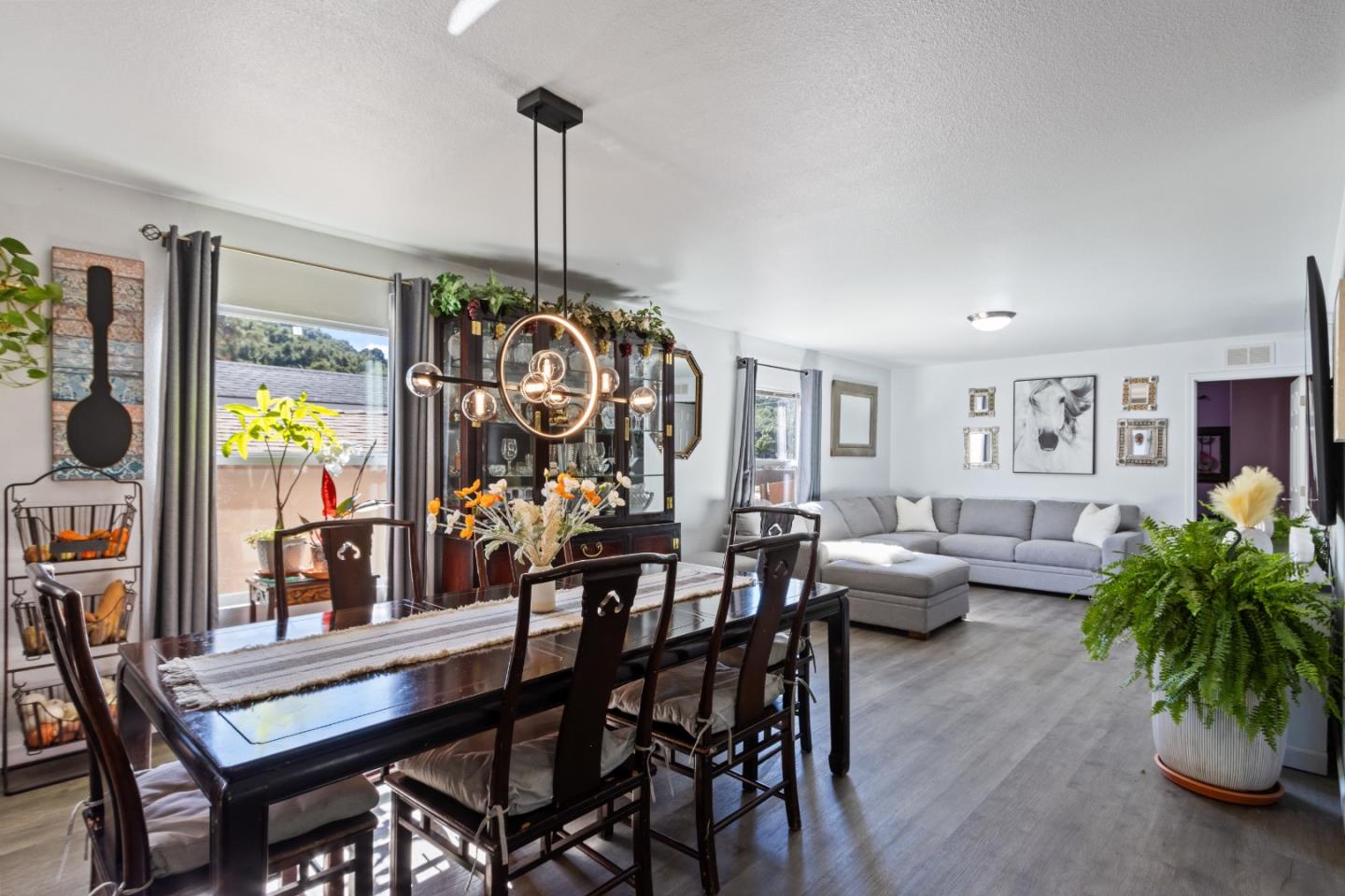 37200 Nason Road, Unit 18 Carmel Valley, CA 93924 - Photo 14 of 71 a view of a dining room with furniture window and wooden floor