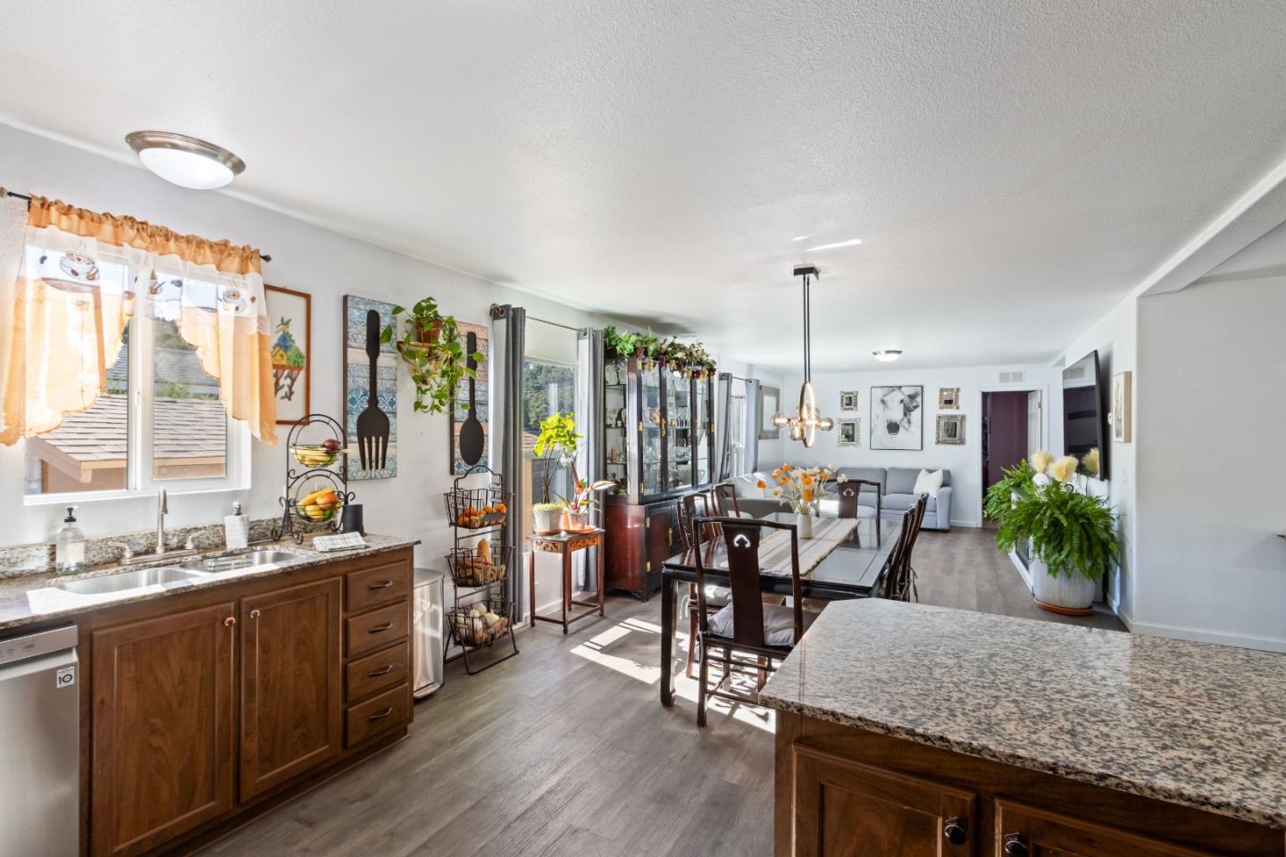 37200 Nason Road, Unit 18 Carmel Valley, CA 93924 - Photo 17 of 71 a view of a a dining room with furniture window and wooden floor