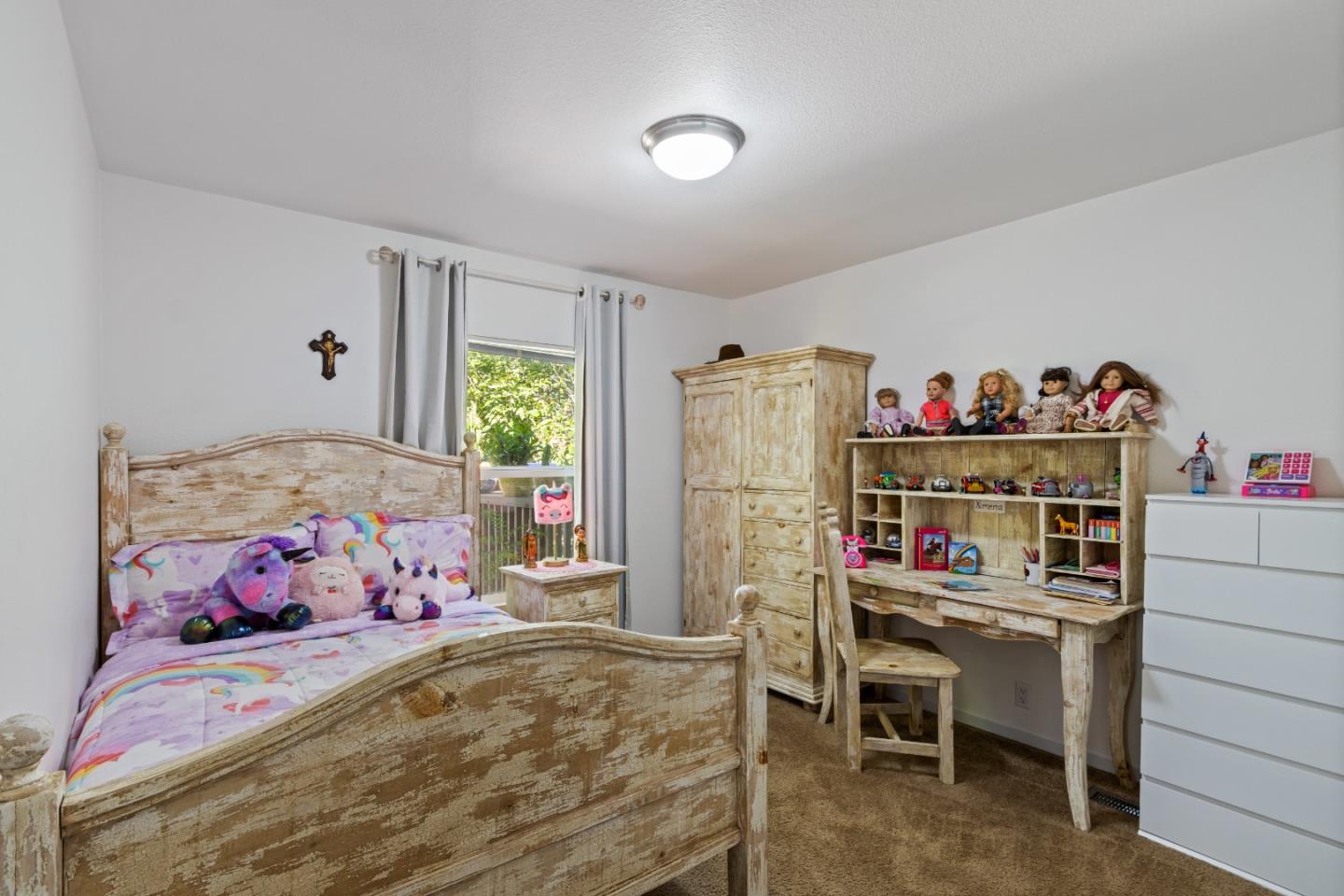 37200 Nason Road, Unit 18 Carmel Valley, CA 93924 - Photo 26 of 71 a bedroom with a bed and a dresser in it