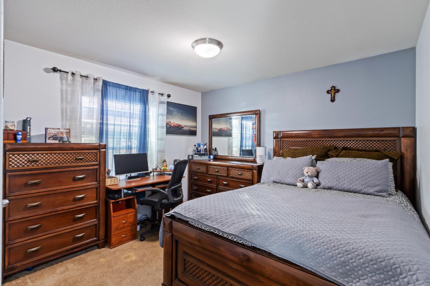 37200 Nason Road, Unit 18 Carmel Valley, CA 93924 - Photo 27 of 71 a bedroom with a bed and a dresser