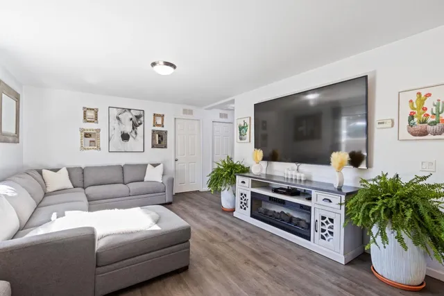 a living room with furniture and a large window