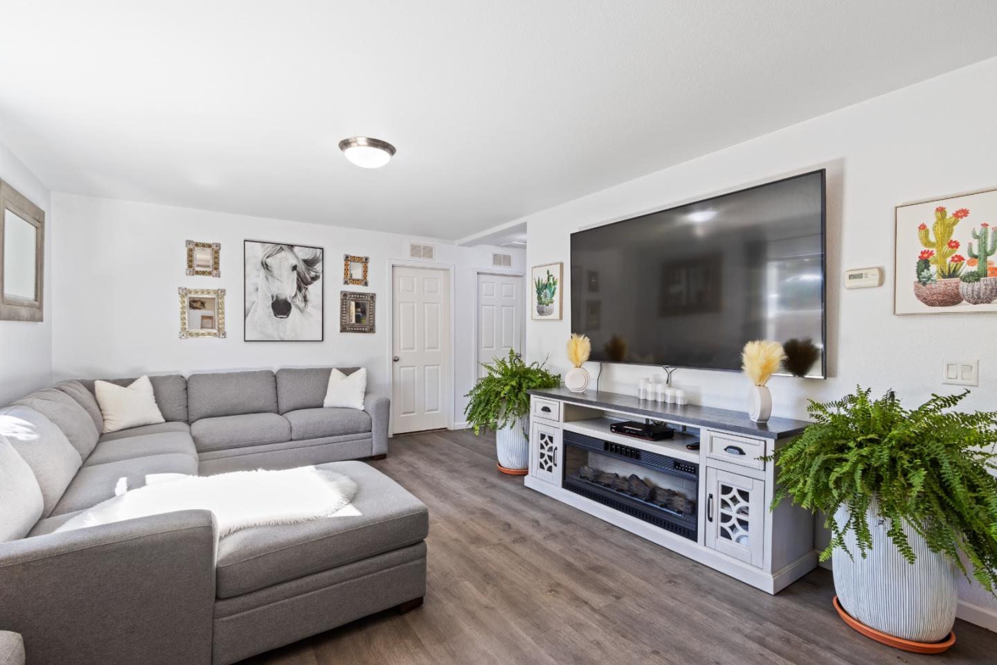 37200 Nason Road, Unit 18 Carmel Valley, CA 93924 - Photo 4 of 71 a living room with furniture and a flat screen tv