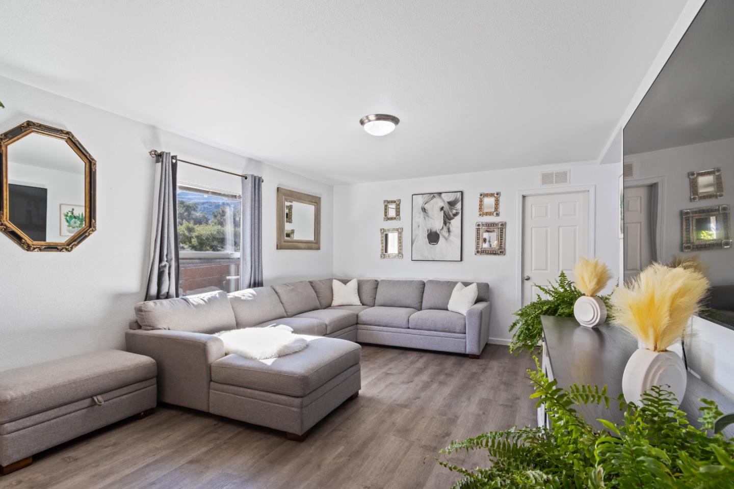 37200 Nason Road, Unit 18 Carmel Valley, CA 93924 - Photo 5 of 71 a living room with furniture and a large window
