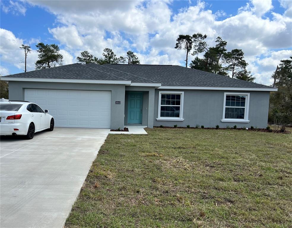 16843 Southwest 25th Terrace Road Ocala, FL 34473 - Photo 1 of 1 a house view with a garden space