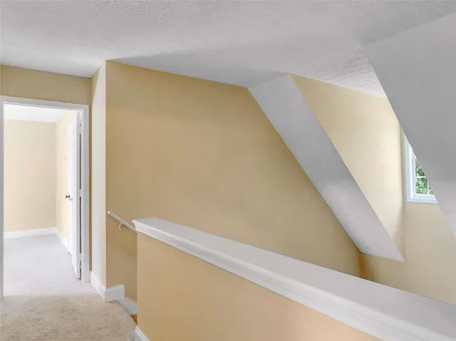 a view of staircase with wooden floor