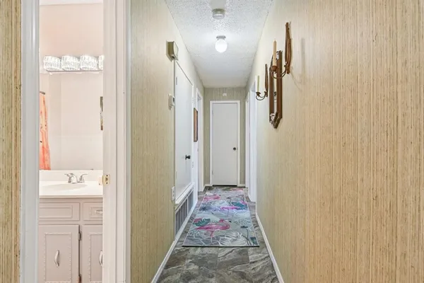 a bathroom with a sink and mirror