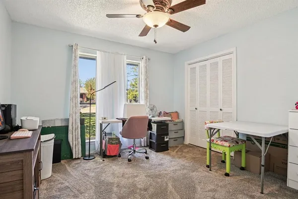 a view of a workspace with furniture