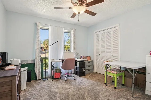 a view of a workspace with furniture