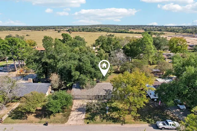 a view of a lake with houses in the back