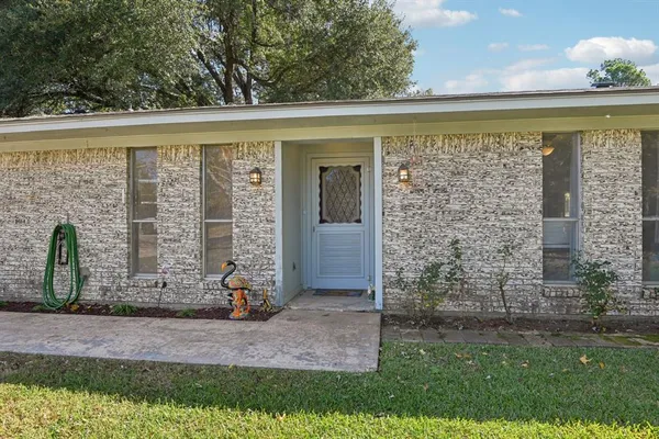a view of a door front of house with a yard