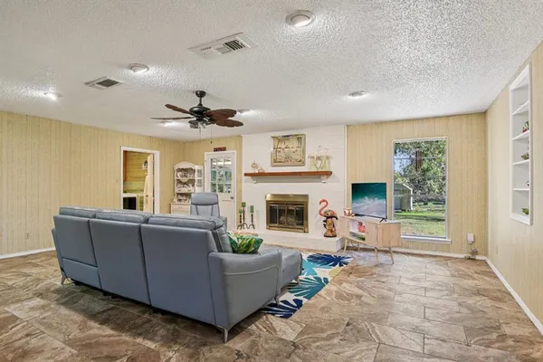 a living room with furniture and a fireplace