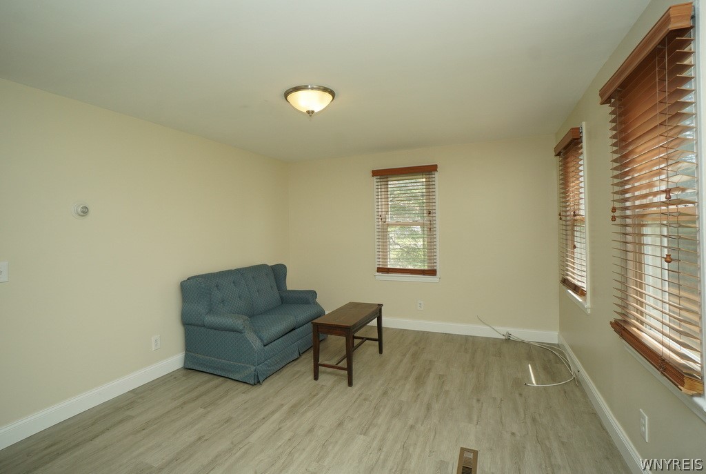 13402 Main Street Newstead, NY 14001 - Photo 7 of 17 The flooring continues into the living room!