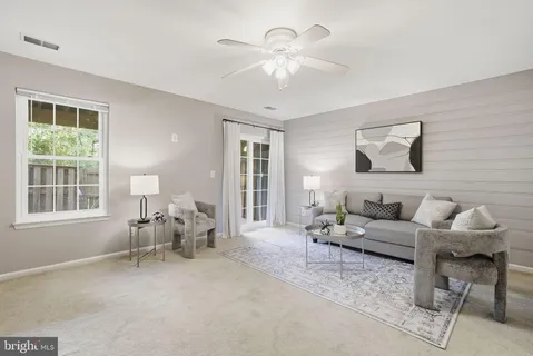 a living room with furniture and window
