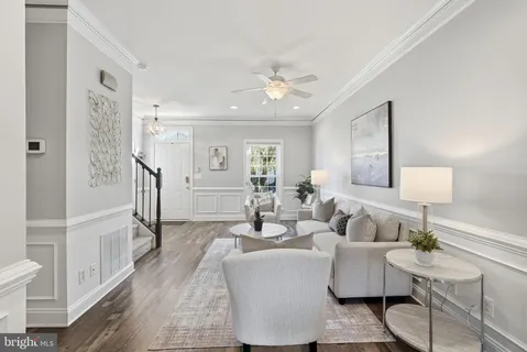 a living room with fireplace furniture and a wooden floor