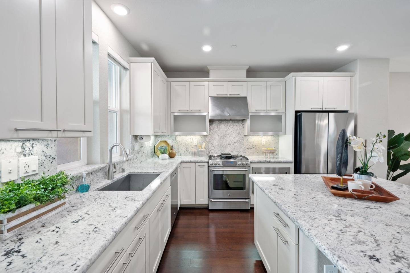 5977 Larkstone Loop San Jose, CA 95123 - Photo 15 of 63 a kitchen with stainless steel appliances granite countertop a sink stove and refrigerator
