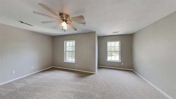 a view of empty room with windows