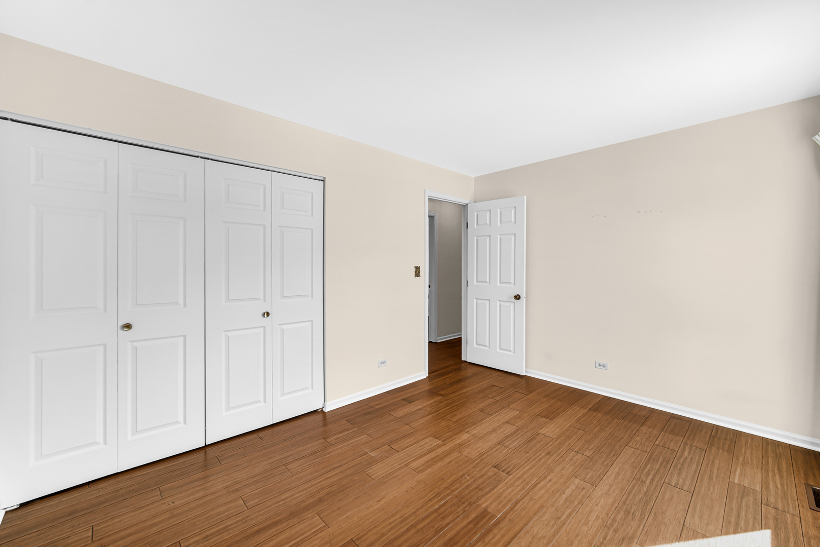 244 Lincoln Drive Bartlett, IL 60103 - Photo 13 of 24 a view of an empty room with wooden floor