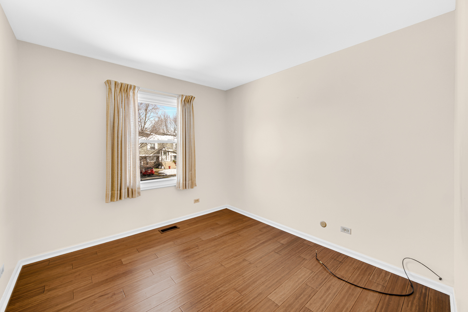 244 Lincoln Drive Bartlett, IL 60103 - Photo 15 of 24 an empty room with wooden floor and windows