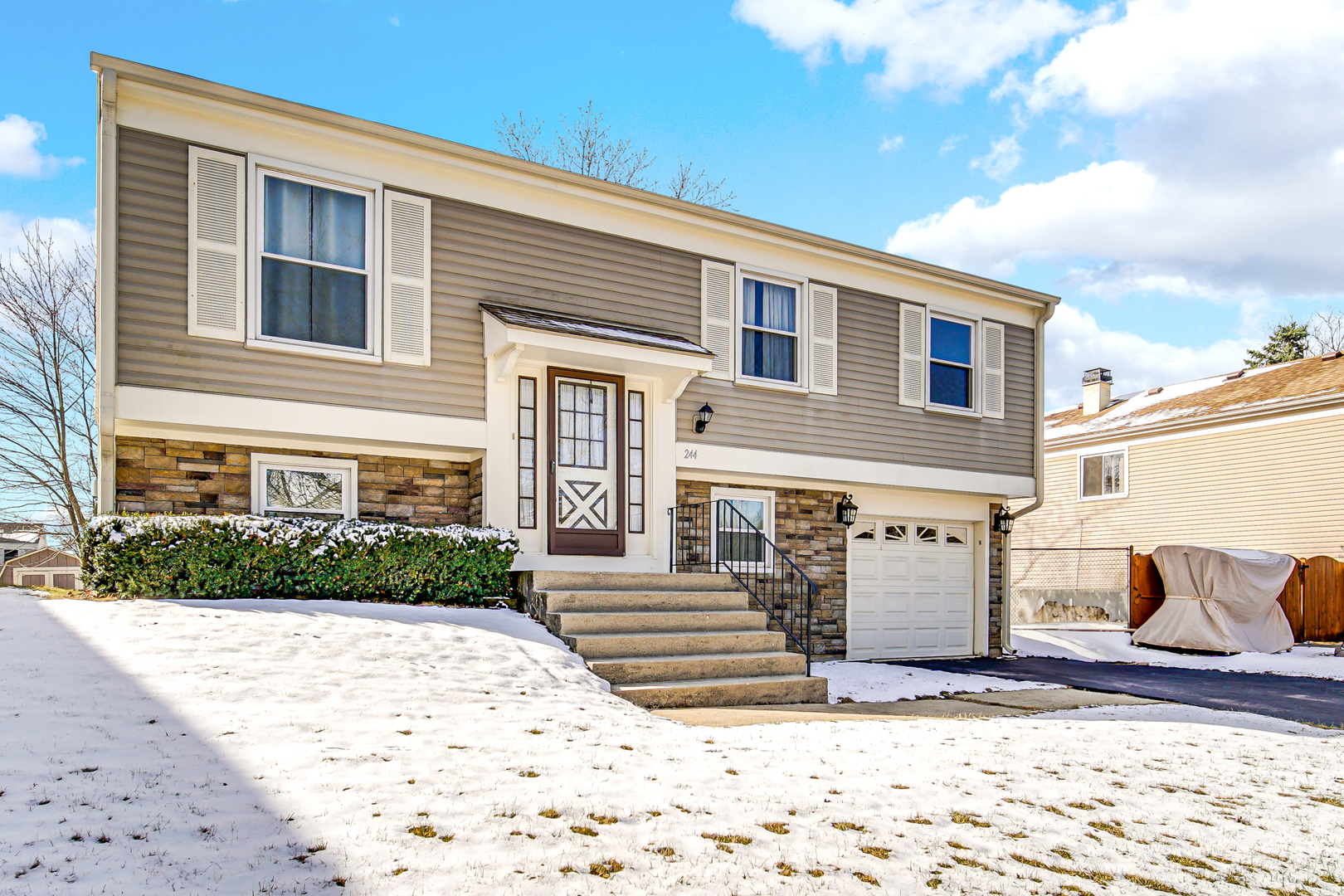 244 Lincoln Drive Bartlett, IL 60103 - Photo 3 of 24 a front view of a house with a yard