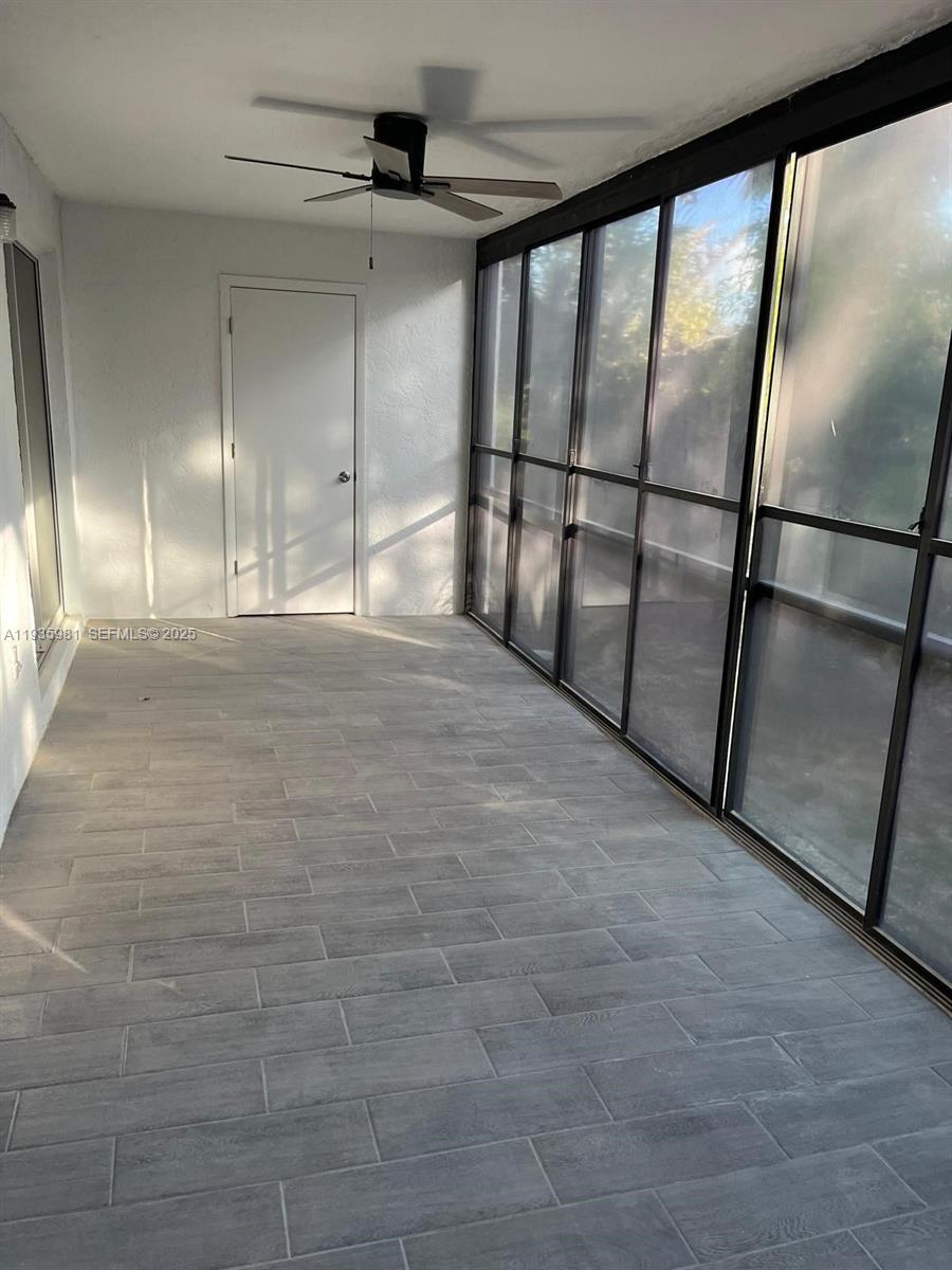 6800 Placida Road, Unit 132 Englewood, FL 34224 - Photo 3 of 33 Lanai with newly installed tiles and has a storage closet.