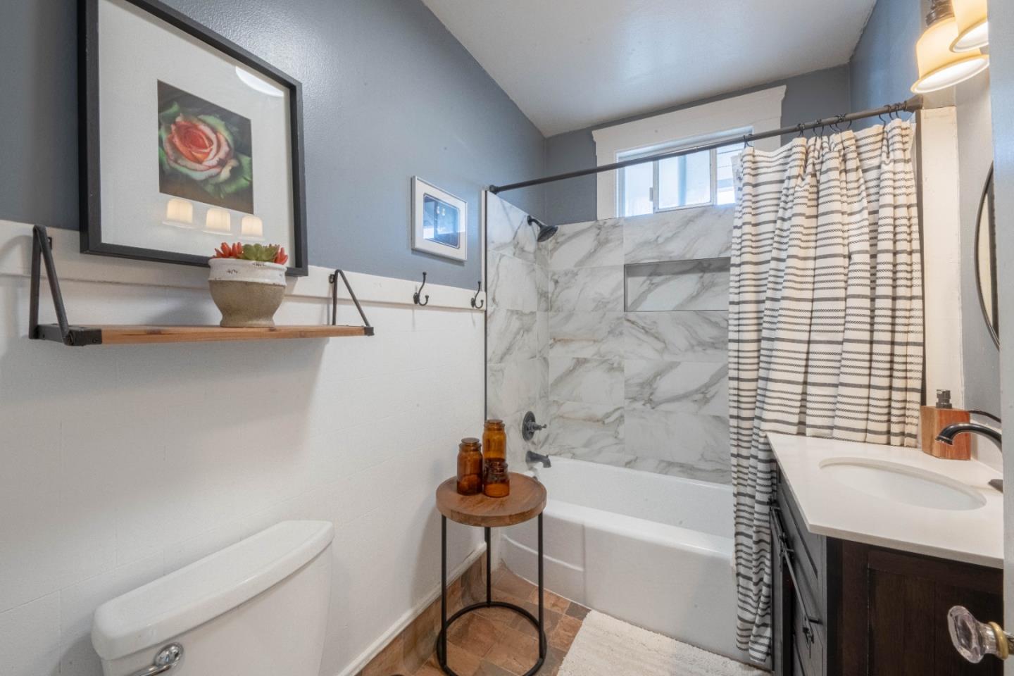 18 Chestnut Street Salinas, CA 93901 - Photo 19 of 32 a bathroom with a granite countertop bathtub sink vanity mirror and toilet