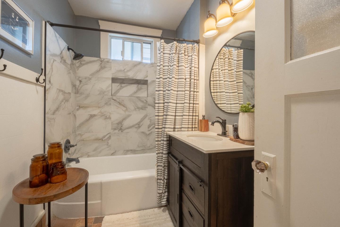 18 Chestnut Street Salinas, CA 93901 - Photo 20 of 32 a bathroom with a sink a bathtub and a shower