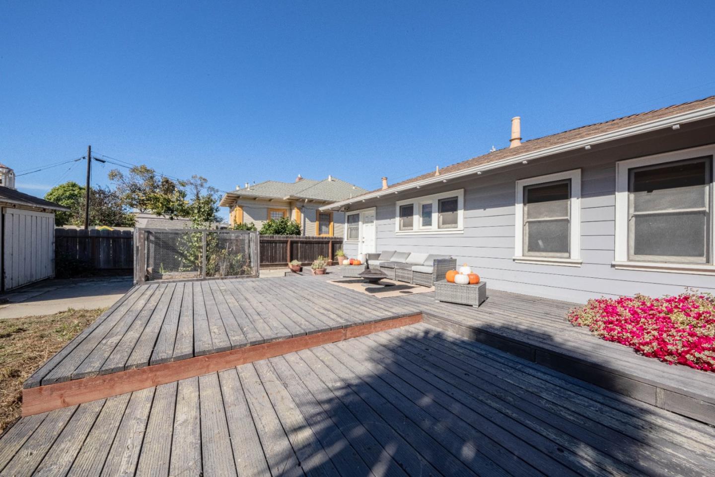 18 Chestnut Street Salinas, CA 93901 - Photo 28 of 32 a view of a deck with dining table and chairs with wooden floor