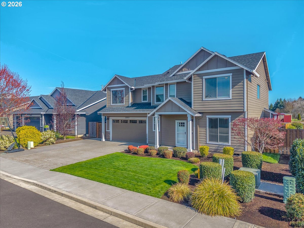 33955 Southeast Vine Street Scappoose, OR 97056 - Photo 4 of 44 a front view of a house with garden