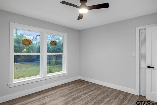 an empty room with window and outdoor view